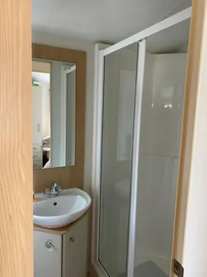 a bathroom with a shower and a sink at Nicks & Carmels by the sea in Heysham