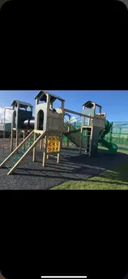 a playground with two play equipment in a park at Nicks & Carmels by the sea in Heysham