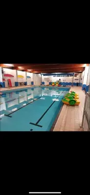 a large swimming pool in a large room at Nicks & Carmels by the sea in Heysham