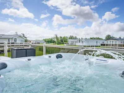 a hot tub with a water fountain at Links Lodge in Grange Over Sands