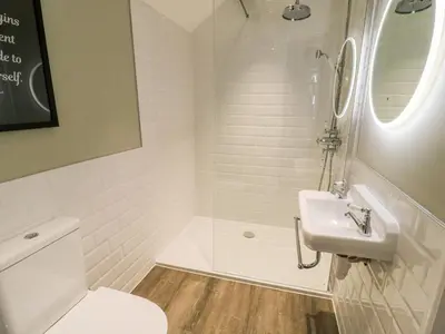 a bathroom with a toilet and a sink at Manor House in Accrington