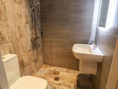 a bathroom with a toilet and a sink at Manor House in Accrington