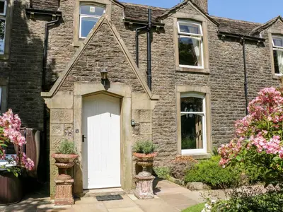 a brick house with a white door at Manor House in Accrington