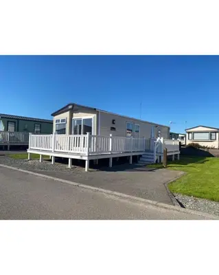 a mobile home on the side of the road at 37 Bay View Oceans Edge by Waterside Holiday Lodges in Lancaster