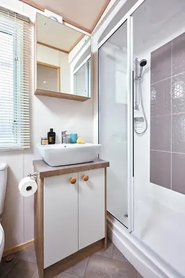a bathroom with a sink and a shower at 37 Bay View Oceans Edge by Waterside Holiday Lodges in Lancaster