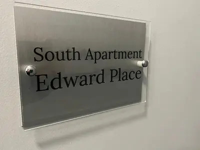a sign on a door that reads south apartmentward place at Edward Place Luxury Hot Tub Apartments in Blackpool