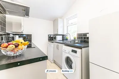 a white kitchen with a bowl of fruit on a counter at Modern 3BR House in Ince Ideal for Contractors & Long Stays in Pemberton