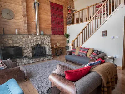 a living room with a couch and a fireplace at Casa Loma in Carnforth