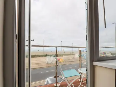 a room with a window with a view of a street at The Beach House in Cleveleys