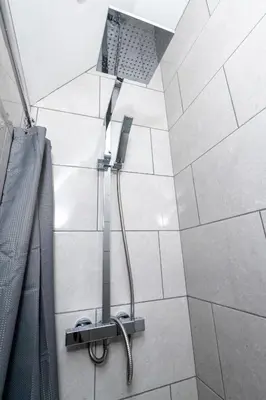 a shower with a shower head in a bathroom at North Lodge in Lancaster
