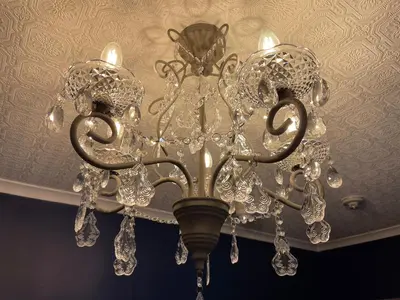 a chandelier is hanging from a ceiling at Delovely Hotel in Blackpool