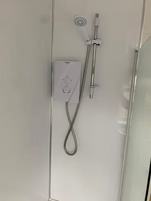 a shower with a shower head on a wall at Beautiful house in a perfect location in Saint Annes on the Sea