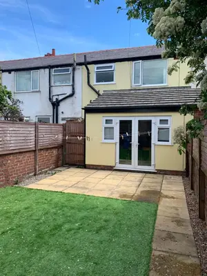 a house with a patio and a fence at Beautiful house in a perfect location in Saint Annes on the Sea