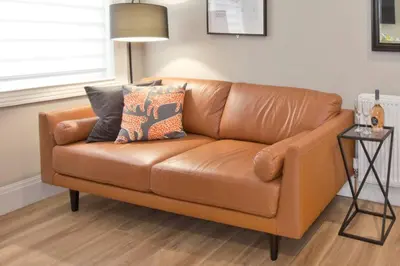a brown leather couch in a living room at Blackbird Luxury 2 Bed Accommodation Room 7 in Blackpool