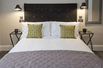 a bedroom with a large bed with two night stands at Blackbird Luxury 2 Bed Accommodation Room 7 in Blackpool