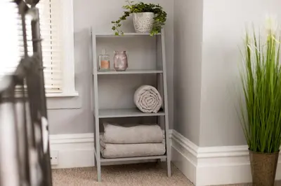 a shelf with towels and plants in a room at Cottage - Sleeps4 - PetFriendly - Garden - ByBeach in Saint Annes on the Sea