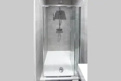 a shower with a glass door in a bathroom at Blackbird Luxury 2 Bed Accomodation Room 8 in Blackpool