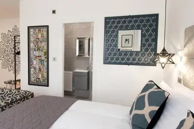 a bedroom with a bed and a bathroom at Blackbird Luxury Accommodation Studio Room 9 in Blackpool