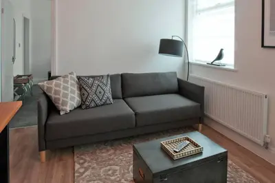 a living room with a couch and a table at Blackbird Luxury Accommodation Room 10 in Blackpool