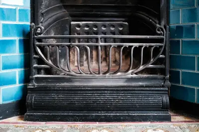 an old black oven in a blue brick wall at Period Retreat for 6, explore the Lake District in Lancaster
