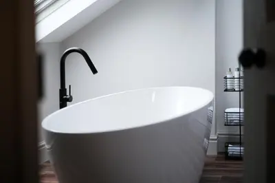 a white bath tub in a bathroom with a window at Period Retreat for 6, explore the Lake District in Lancaster