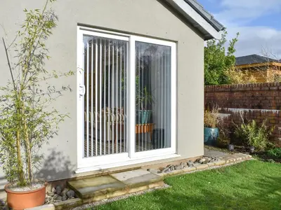 a window with bars on it in a garden at Belmont in Longton