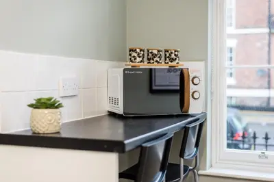 a microwave sitting on a counter in a kitchen at Host & Stay - Canning Quarters in Liverpool