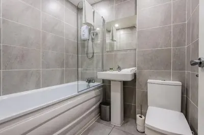 a bathroom with a toilet and a sink and a shower at Host & Stay - Catharine Quarters in Liverpool