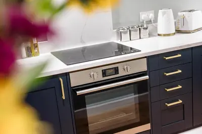 a kitchen with a stove and a sink at Host & Stay - Catharine Quarters in Liverpool