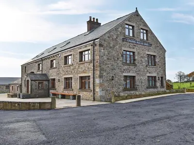 an old stone building with a street in front of it at One Dorchester Drive - Uk32037 in Inglewhite