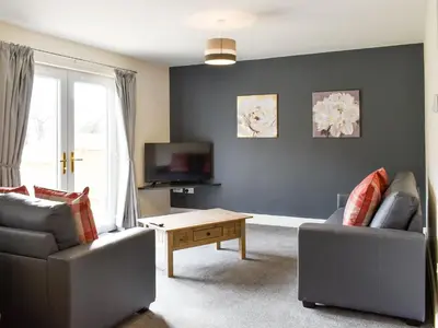 a living room with a couch and a coffee table at Five Dorchester Drive - Uk32043 in Inglewhite