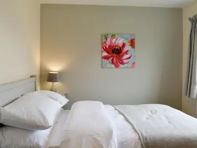 a bedroom with two white beds and a painting on the wall at Three Dorchester Drive - Uk32039 in Inglewhite