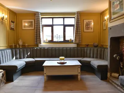 a living room with a couch and a table at Two Dorchester Drive - Uk32036 in Inglewhite