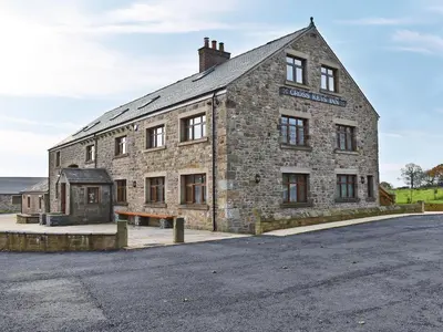 an old stone building with a street in front of it at Four Dorchester Drive - Uk32042 in Inglewhite