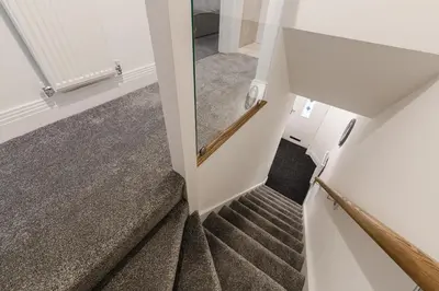 a stairwell in a house with a view of the stairs at Tannery Place - 3 Bedrooms Parking Wi-Fi Garden in Freckleton