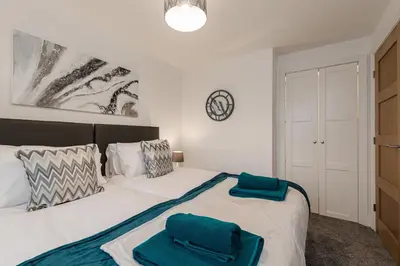 a bedroom with a bed with two pillows on it at Tannery Place - 3 Bedrooms Parking Wi-Fi Garden in Freckleton