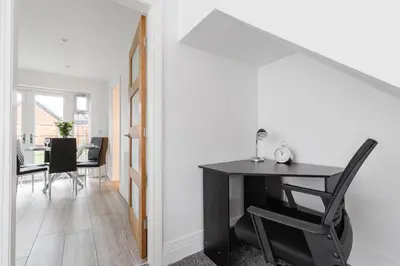 a dining room with a black desk and a table at Tannery House - 3 Bedrooms, Parking, Wi-Fi, Garden in Freckleton