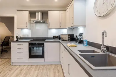 a kitchen with white cabinets and a sink at Tannery House - 3 Bedrooms, Parking, Wi-Fi, Garden in Freckleton