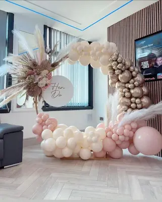 a balloon arch in a room with pink and white balloons at Eleanor Rigby apts Stanley Street in Liverpool