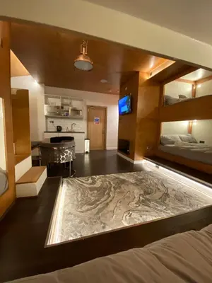 a large room with a large bed and a television at Eleanor Rigby apts Stanley Street in Liverpool