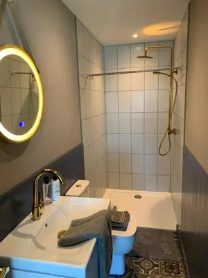 a bathroom with a sink and a shower and a toilet at Beach View Apartment with balcony and sea view - pet friendly in Cleveleys