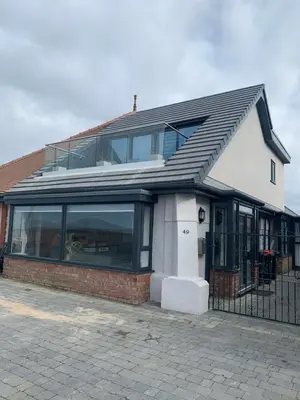 a building with a lot of windows on it at Beach View Apartment with balcony and sea view - pet friendly in Cleveleys