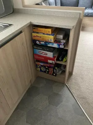 a book shelf filled with books in a kitchen at Blackpool Static Caravan Marton Mere in Blackpool