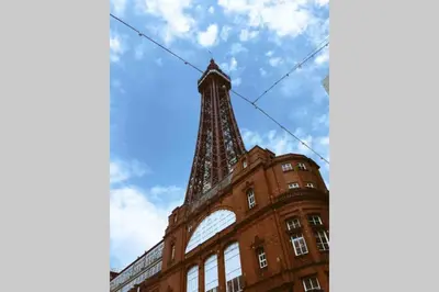 a building with a tower on top of it at Langan's Blackpool Holiday Let in Blackpool