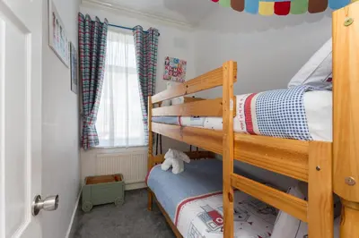 a bunk bed in a room with a bunk bedutenewayangering at Langan's Blackpool Holiday Let in Blackpool