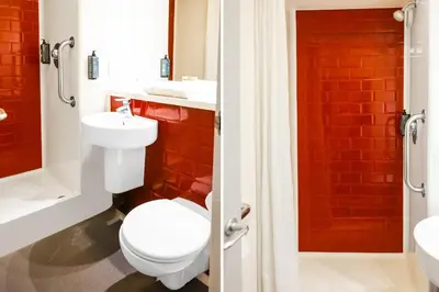 a bathroom with a toilet and a sink at GO2 Lancaster Centre Hotel by OYO in Lancaster