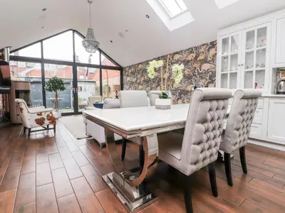 a dining room with a table and chairs at Westwood House in Lytham St Annes