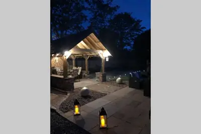 a lit up gazebo at night with two candles at Dove Nest Cottage Blackpool Lytham St Annes in Lytham St Annes