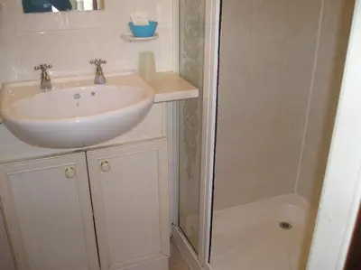 a bathroom with a sink and a shower at The Belvedere in Blackpool