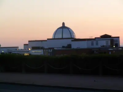 a building with a dome on top of it at sunset at Wavecrest Lodge in Fleetwood